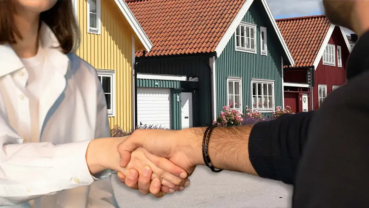 Handslag framför färgglada hus. Kanske en affär som gör det möjligt att **låna till handpenning** för drömhuset.