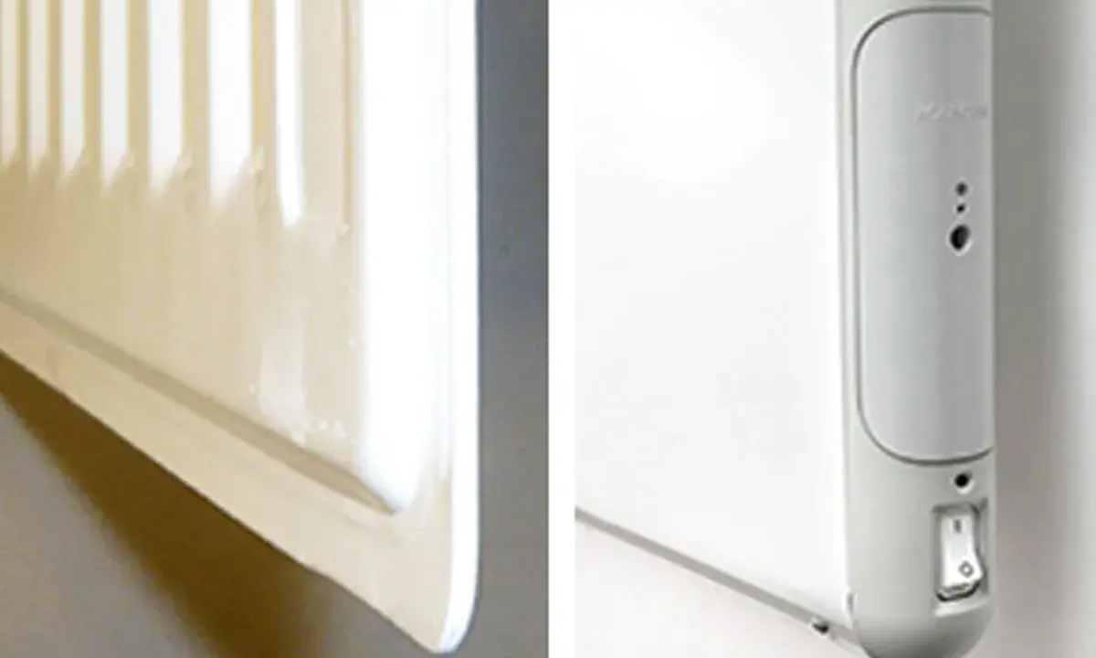 En vit radiator, en del av el element blir inte varmt. En närbild visar en strömbrytare och indikatorlampor på enheten.